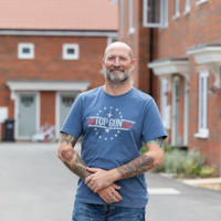 man stood outside house