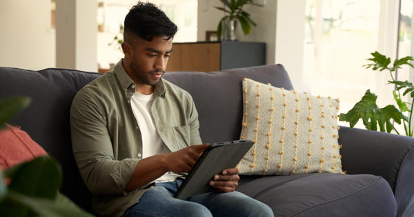 young man on ipad