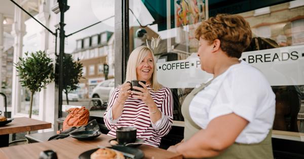 two women having coffee and talking