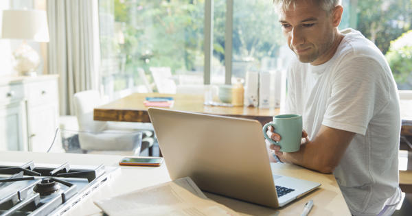 man looking at laptop